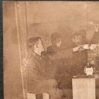 5 Young Men Drinking with Tea Cups By Glowing Lantern Light 5.jpg