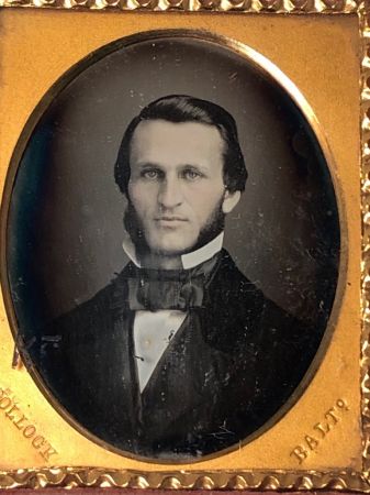 Daguerreotype of man with large square bowtie  stamped Pollack Balto 9.jpg
