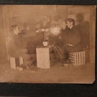 5 Young Men Drinking with Tea Cups By Glowing Lantern Light 1 (in lightbox)