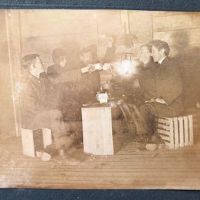 5 Young Men Drinking with Tea Cups By Glowing Lantern Light 2