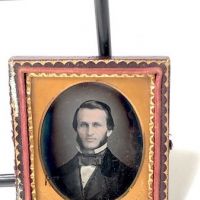 Daguerreotype of man with large square bowtie  stamped Pollack Balto 11.jpg