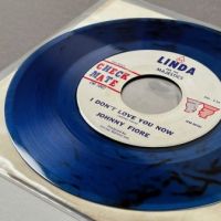 Johnny Fiore Rock A Bye Baby b:w I Don’t Love You Now on Check Mate Clear Blue Vinyl 13 (in lightbox)