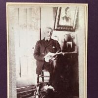 Hebbel Baltimore Photographer Cabinet Card Old Man Reading Wtih Dog 1.jpg