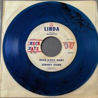 Johnny Fiore Rock A Bye Baby b:w I Don’t Love You Now on Check Mate Clear Blue Vinyl 1 (in lightbox)