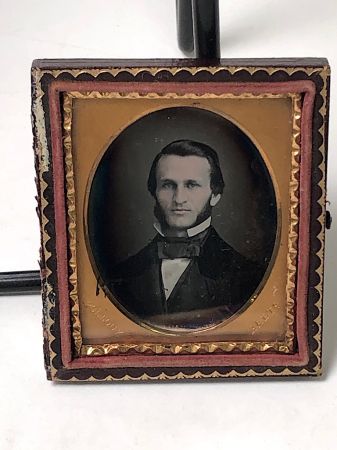 Daguerreotype of man with large square bowtie stamped Pollack Balto 2.jpg