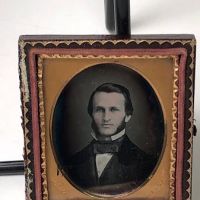 Daguerreotype of man with large square bowtie  stamped Pollack Balto 2.jpg