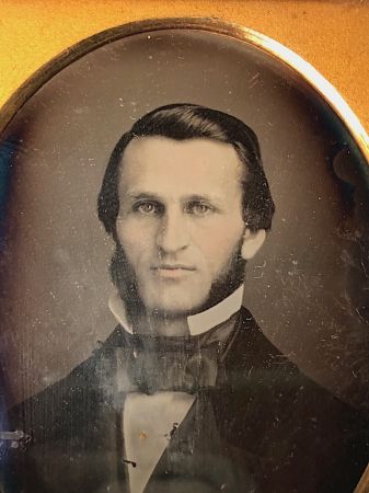 Daguerreotype of man with large square bowtie  stamped Pollack Balto 3.jpg