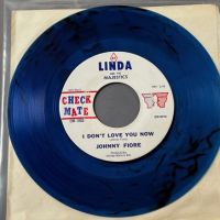Johnny Fiore Rock A Bye Baby b:w I Don’t Love You Now on Check Mate Clear Blue Vinyl 7 (in lightbox)