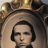 Rose Gold Scalloped Edge Broach with Tintype Portrait of Young man with Beard 3.jpg