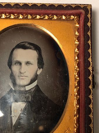 Daguerreotype of man with large square bowtie stamped Pollack Balto 6.jpg
