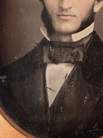 Daguerreotype of man with large square bowtie  stamped Pollack Balto 8.jpg